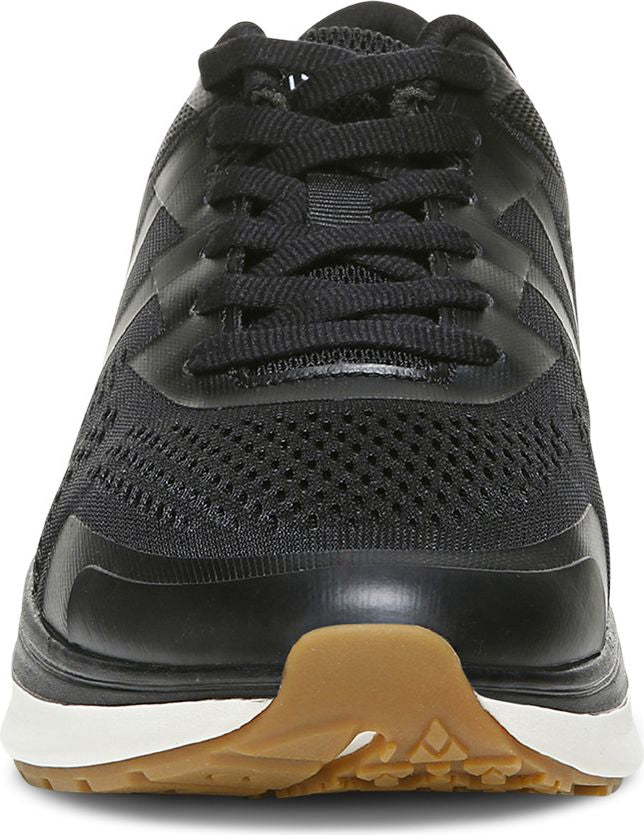 Black athletic shoe with black laces, white midsole, and brown outsole.