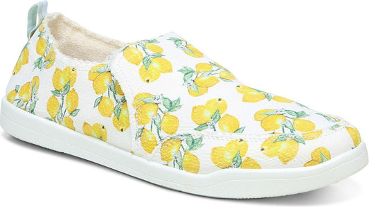 Slip-on sneaker, covered in yellow lemons, on a white rubber sole.