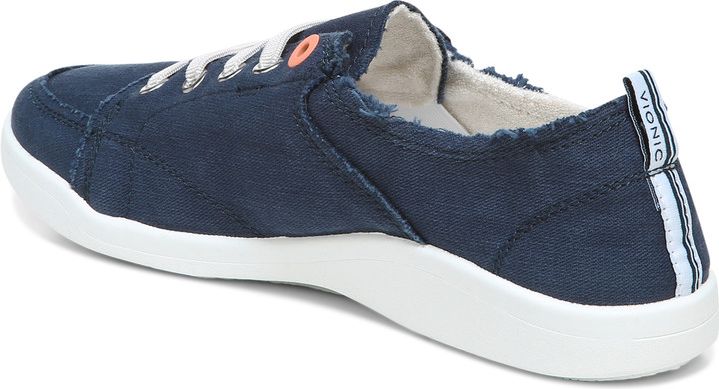 Navy canvas shoe, white laces, white rubber sole and logo text "VIONIC" visible on pull tab.