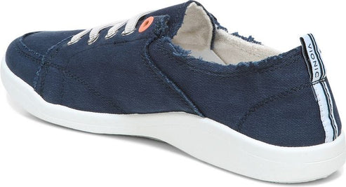 Navy canvas shoe, white laces, white rubber sole and logo text "VIONIC" visible on pull tab.