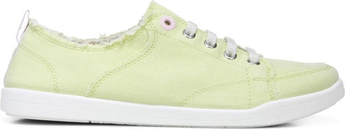 A light green sneaker with white laces and a white sole.