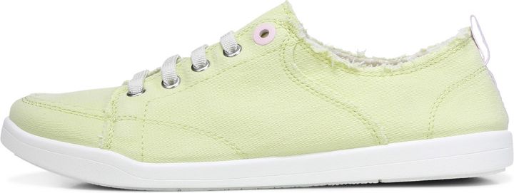 A light green sneaker with white laces and a white sole.