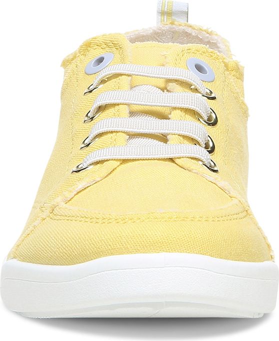 Front view of a yellow casual canvas sneaker with a white sole.