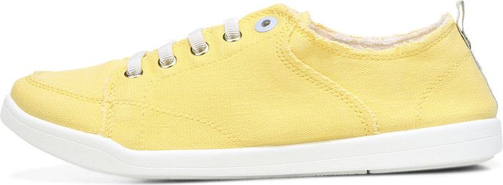 A yellow canvas sneaker with white laces and sole.