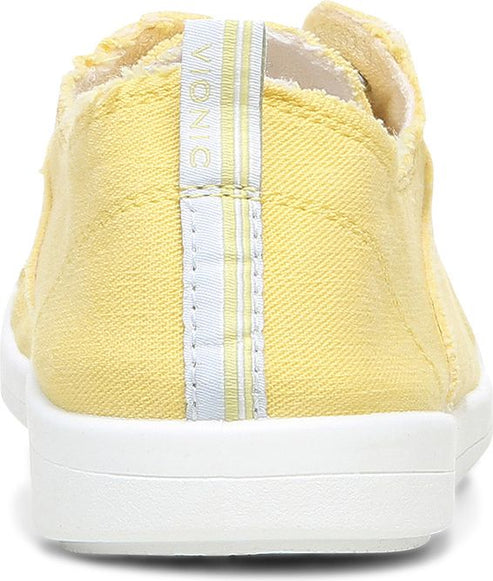 Yellow canvas slip-on sneaker with a white sole and a white stripe at the heel.