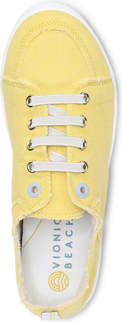 A yellow canvas sneaker with white laces.