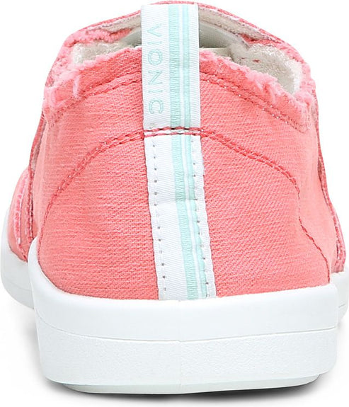 Close-up of pink canvas shoe with white sole and light blue and white stripes on back pull tab.