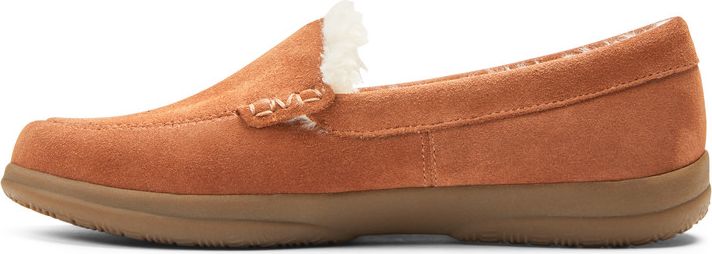 A moccasin-style slipper in tan suede, with a faux fur lining.