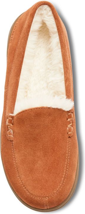 A brown suede loafer-style slipper with white faux fur lining.