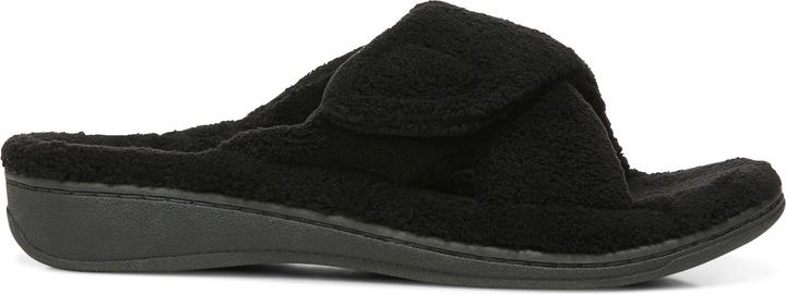 A black slipper with a soft, textured surface and a low, flat sole.