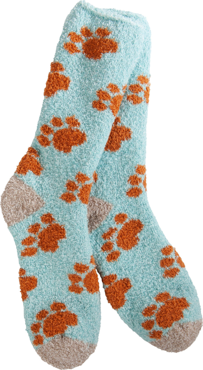 Two blue fuzzy socks with orange paw prints.