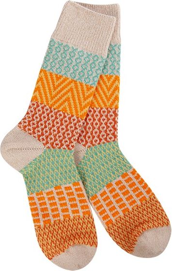 A pair of stacked pattern knit socks, featuring orange, light blue, and cream.