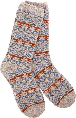 A pair of beige, knit socks with horizontal rows of orange, blue and gray geometric patterns.