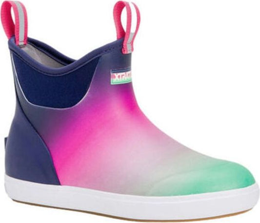 Ankle-high rubber boot with a white sole and pink, green, and blue gradient on the vamp, and a pink pull tab at the collar.